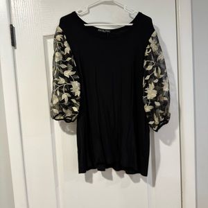 Black shirt with embroidered sleeve